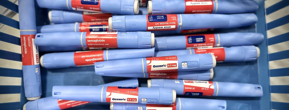 Several Ozempic injection pens arranged in a tray